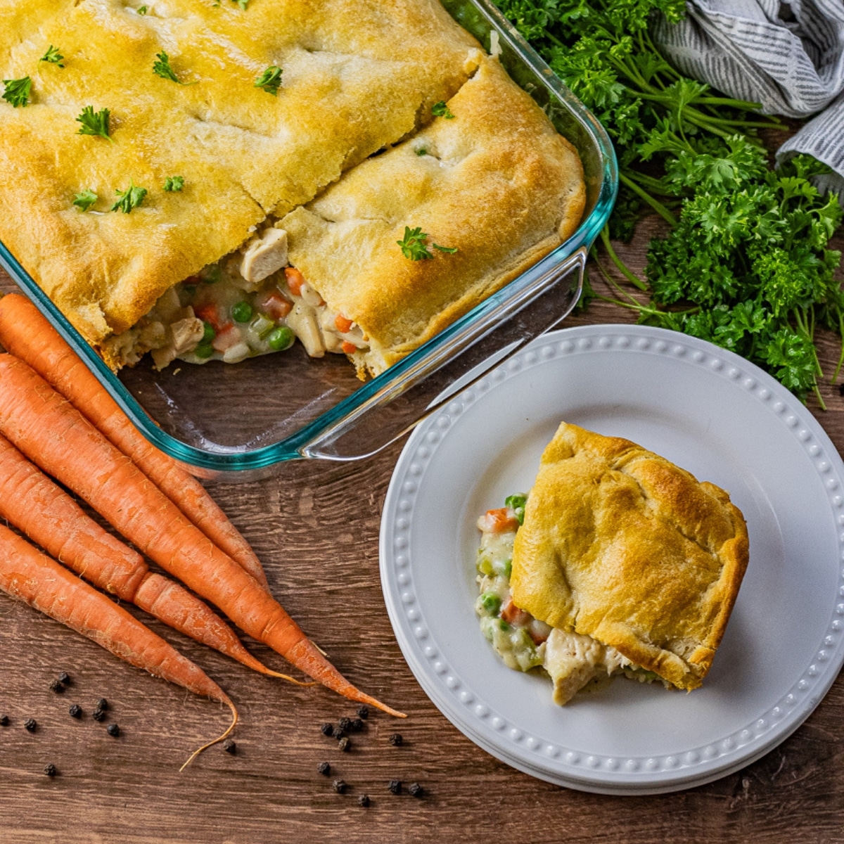 piece of chicken pot pie made with crescent roll on a white plate