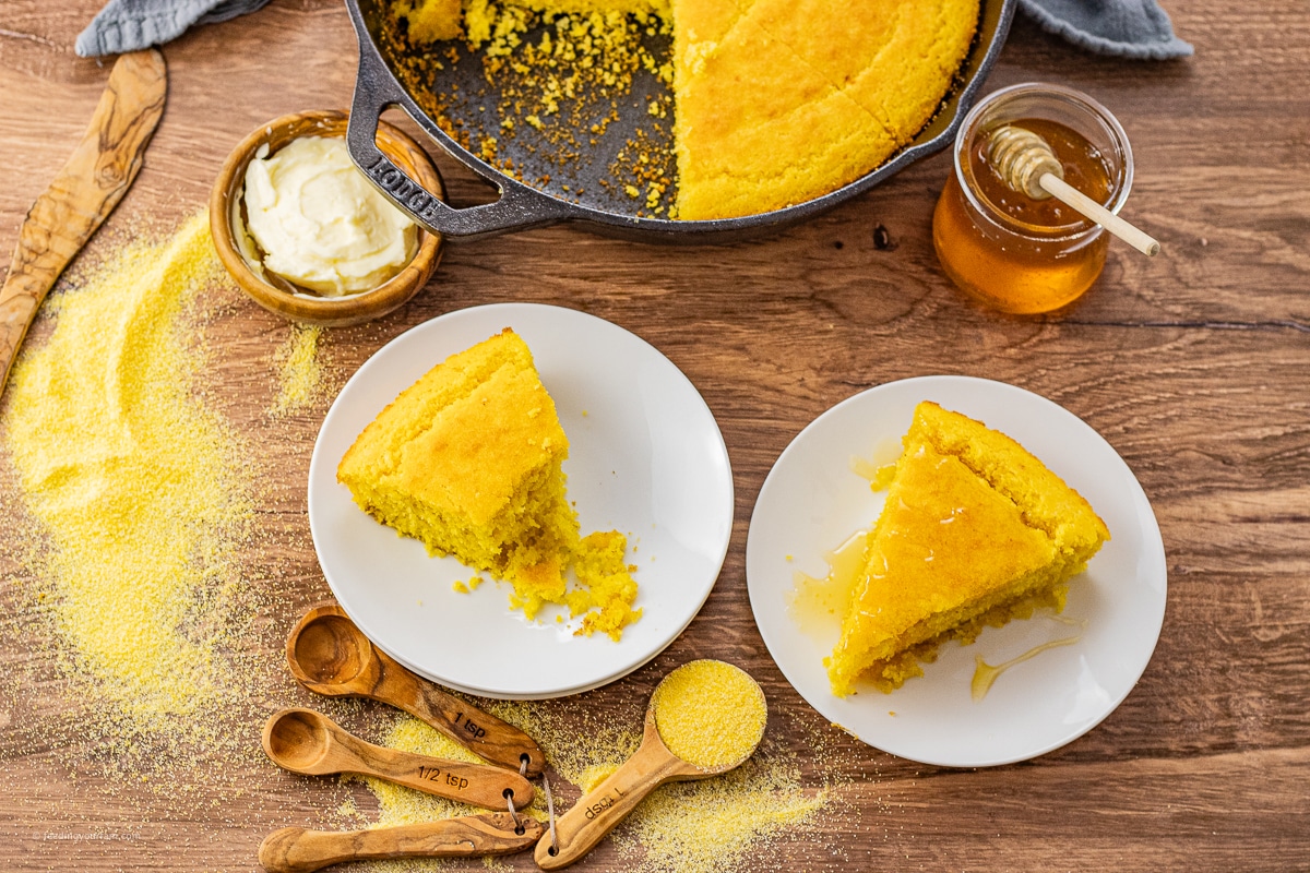 triangular slices of cornbread on white plates