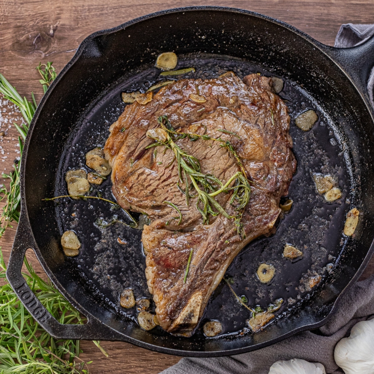 cast iron ribeye steak with garlic and rosemary