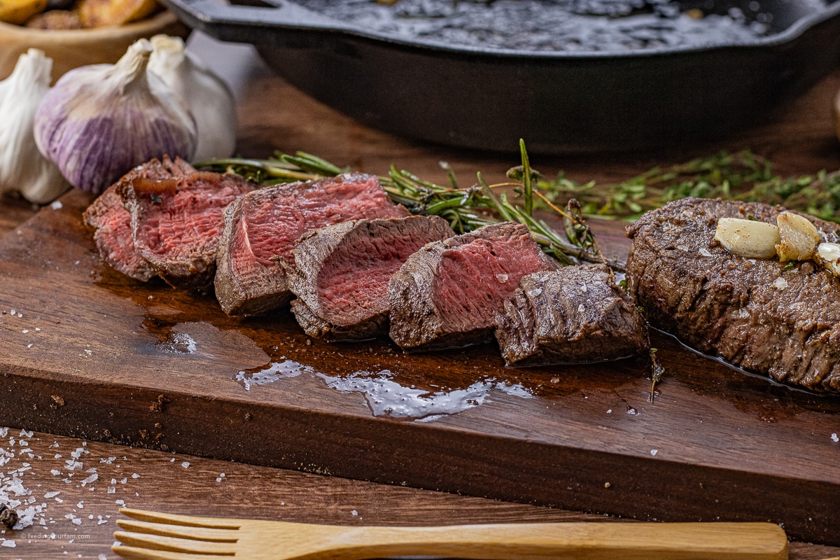sliced filet on a wooden cutting board