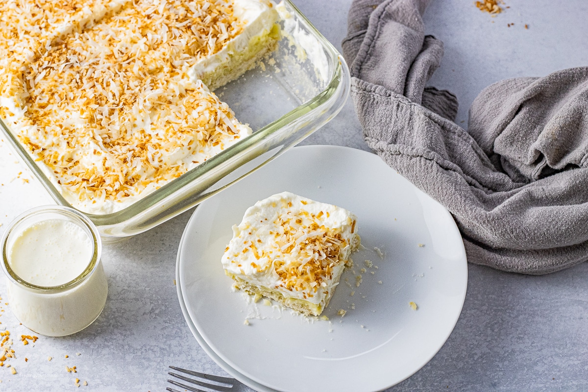 square of coconut cream pie bar on a white plate