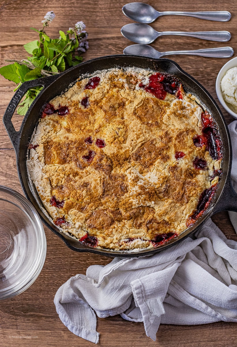 cherry pie filling dump cake made in a cast iron skillet