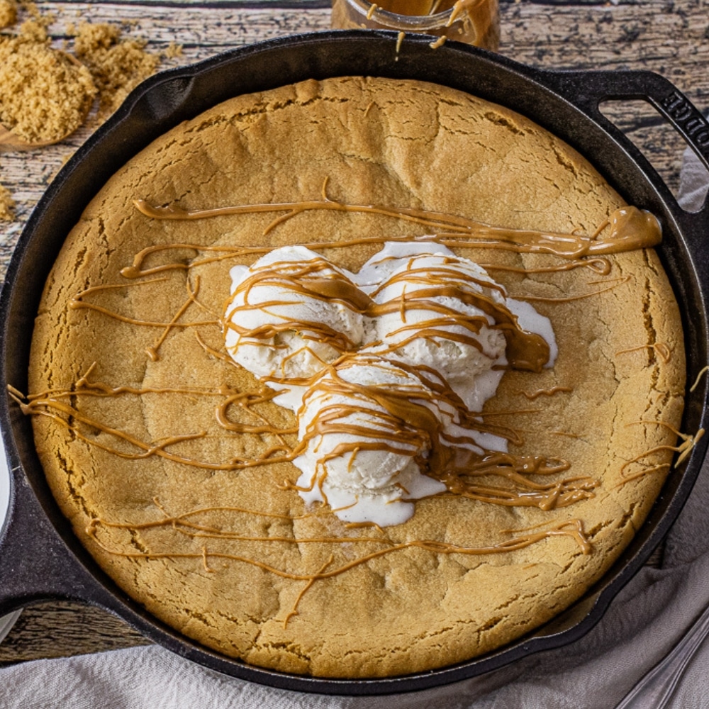 peanut butter skillet cookie topped with vanilla ice cream