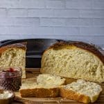 round loaf of cast iron skillet bread on a cutting board