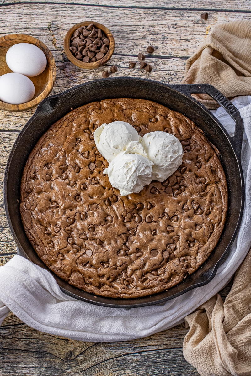 double chocolate chip skillet cookie topped with ice cream