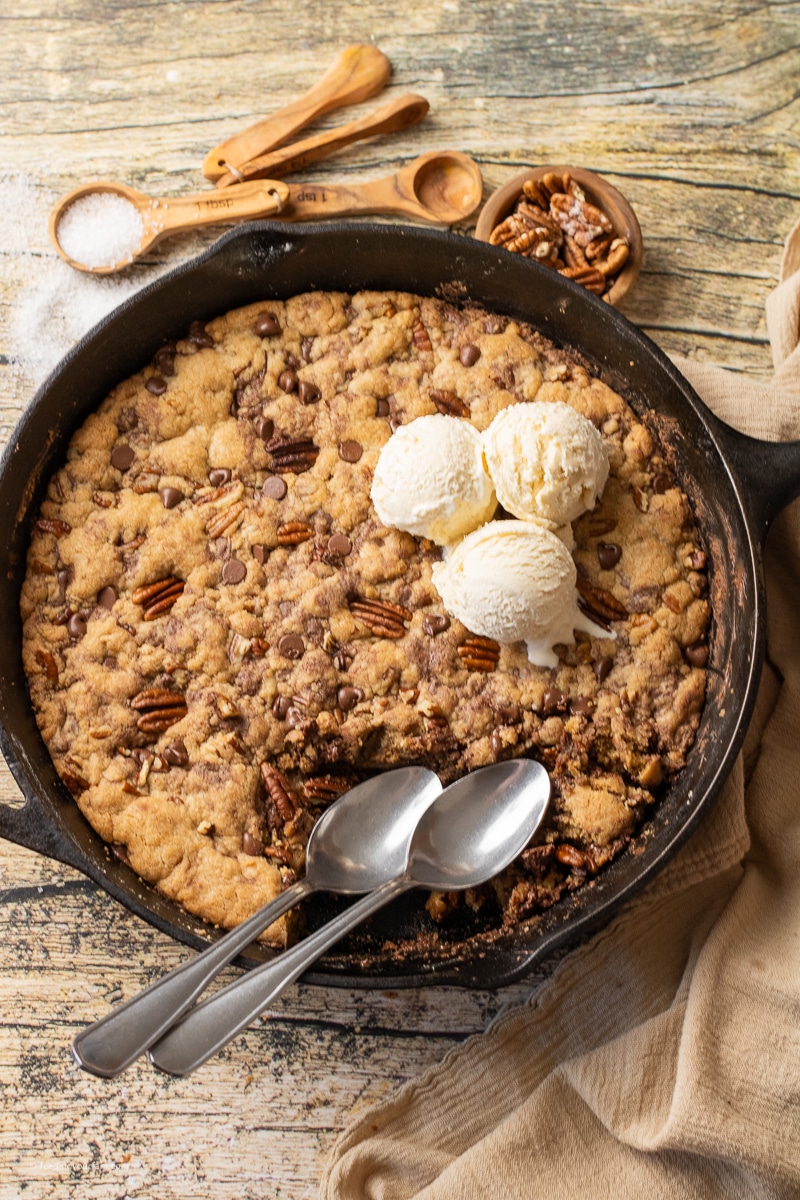 cast iron skillet cookie with pecans and chocolate chips