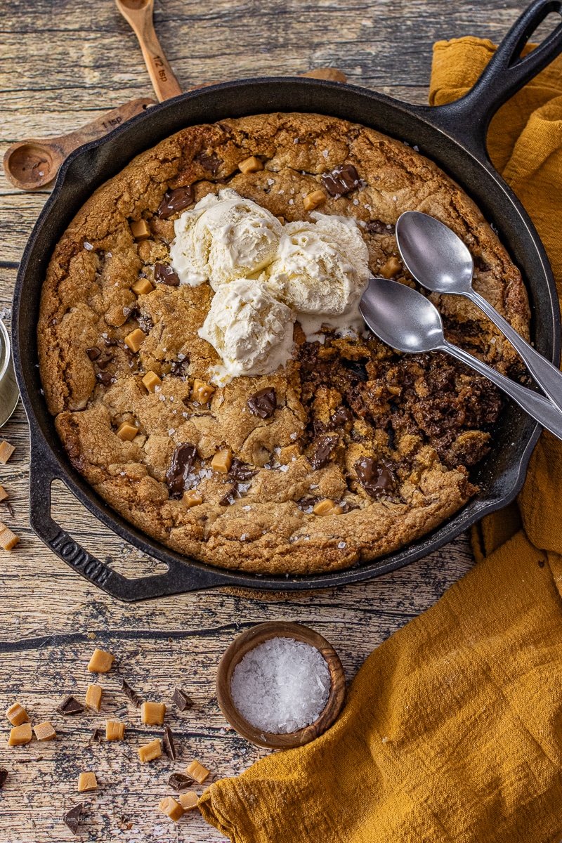 This Salted Caramel Cookie Skillet is the perfect combination of a classic, buttery chocolate chip cookie with a soft, caramel center all baked in one cast iron skillet.