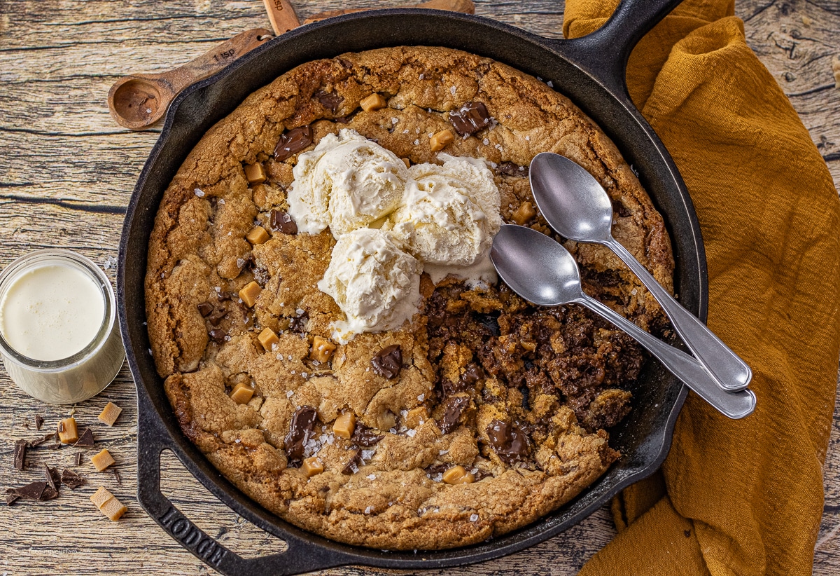 salted caramel chocolate chip cookie in a cast iron skillet