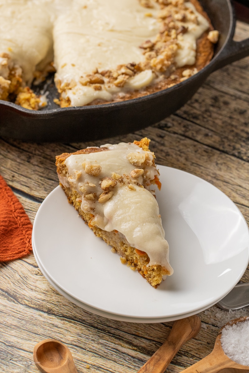 slice of carrot cake on a white plate