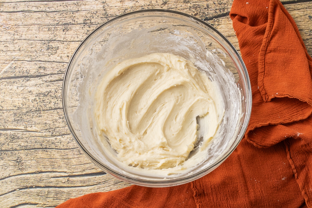 cream cheese frosting in a glass bowl