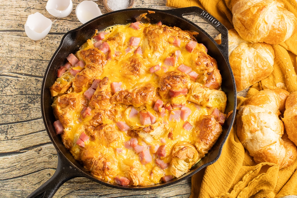 skillet breakfast casserole with ham and cheese and croissants