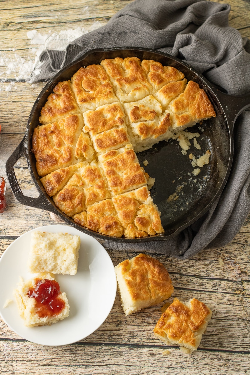 butter swim buttermilk biscuits in a cast iron skillet