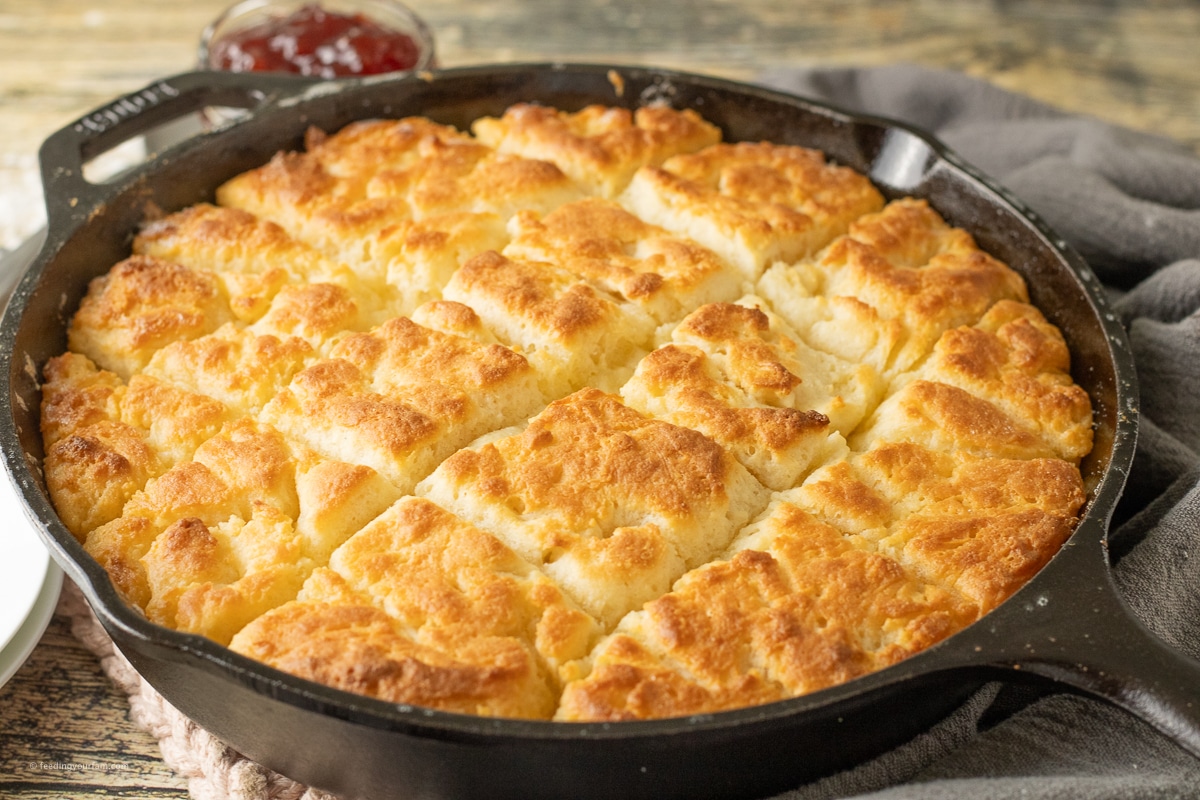 sliced butter swim biscuits in a cast iron skillet