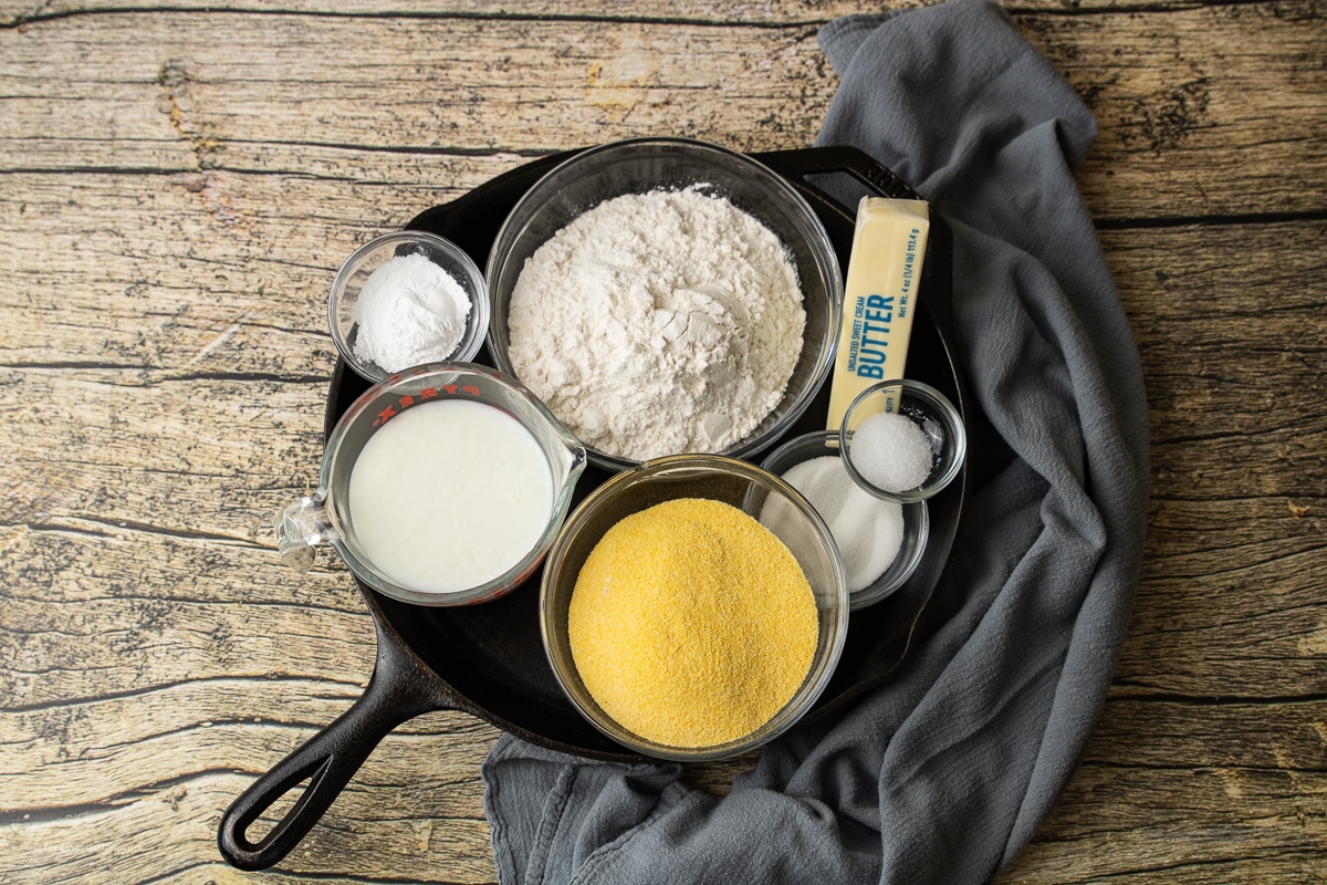 ingredient for cornmeal biscuits in a cast iron skillet