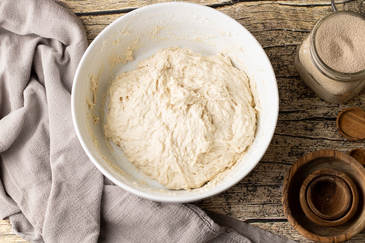 shaggy dough in a white mixing bowl