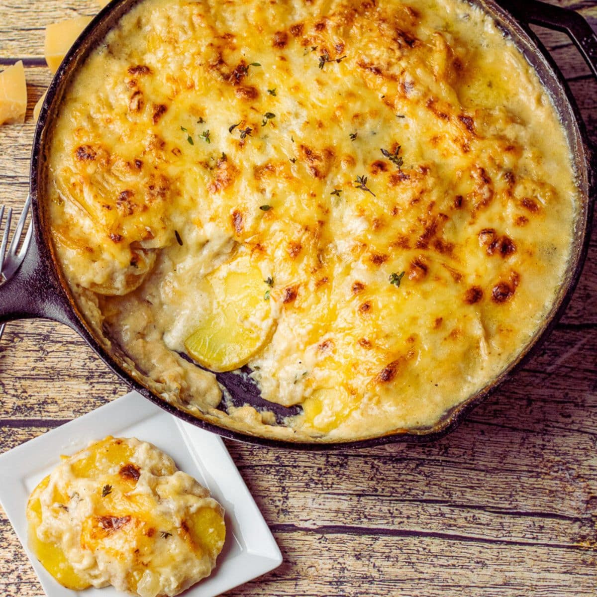 golden potatoes baked in a cheesy cream sauce all baked in a cast iron skillet