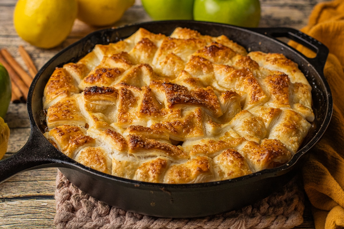 puff pastry apple pie baked in a cast iron skillet