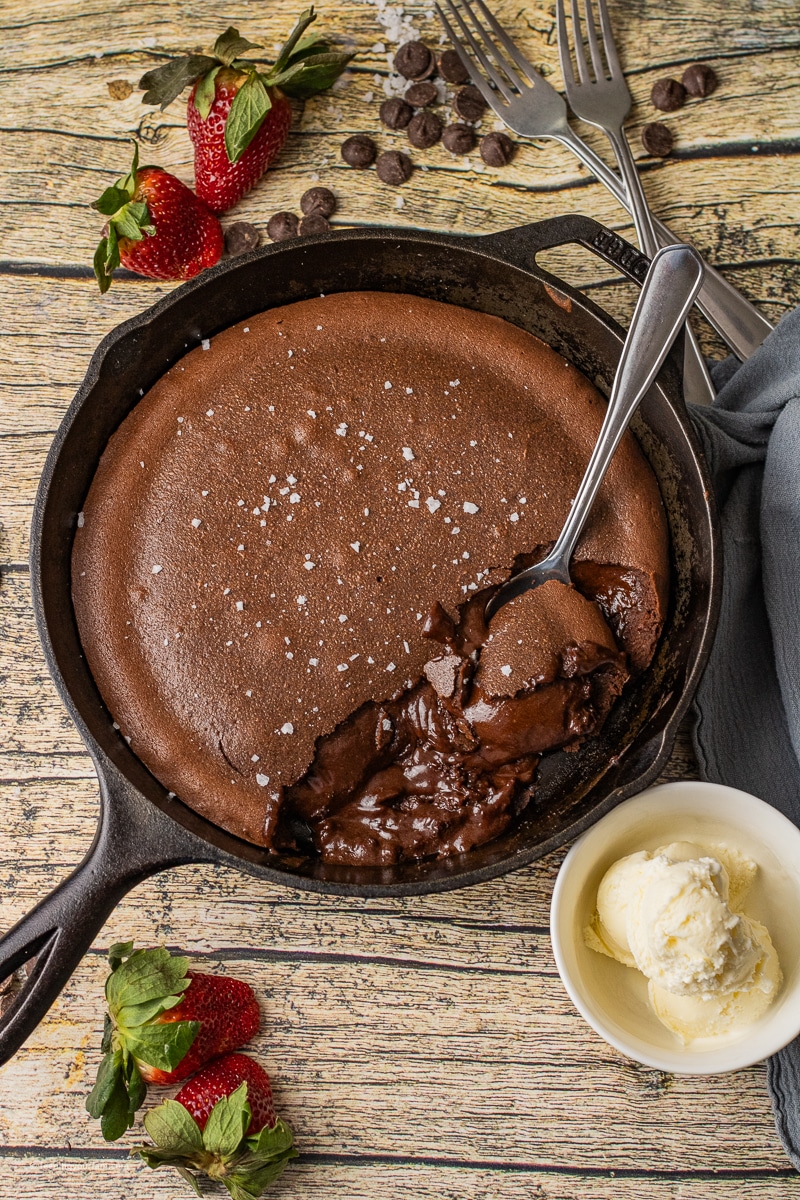 There are so many reasons to fall in love with this Chocolate Lava Cake Recipe baked in a cast iron skillet. For starters, the rich chocolate is hard to resist and each bite is a treat for your tastebuds. This easy chocolate lava cake takes just 7 ingredients and under 20 minutes to make, making it the perfect dessert.