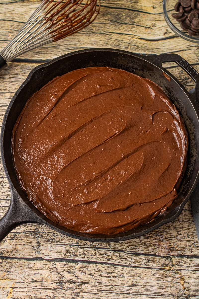 lava cake batter in a cast iron skillet