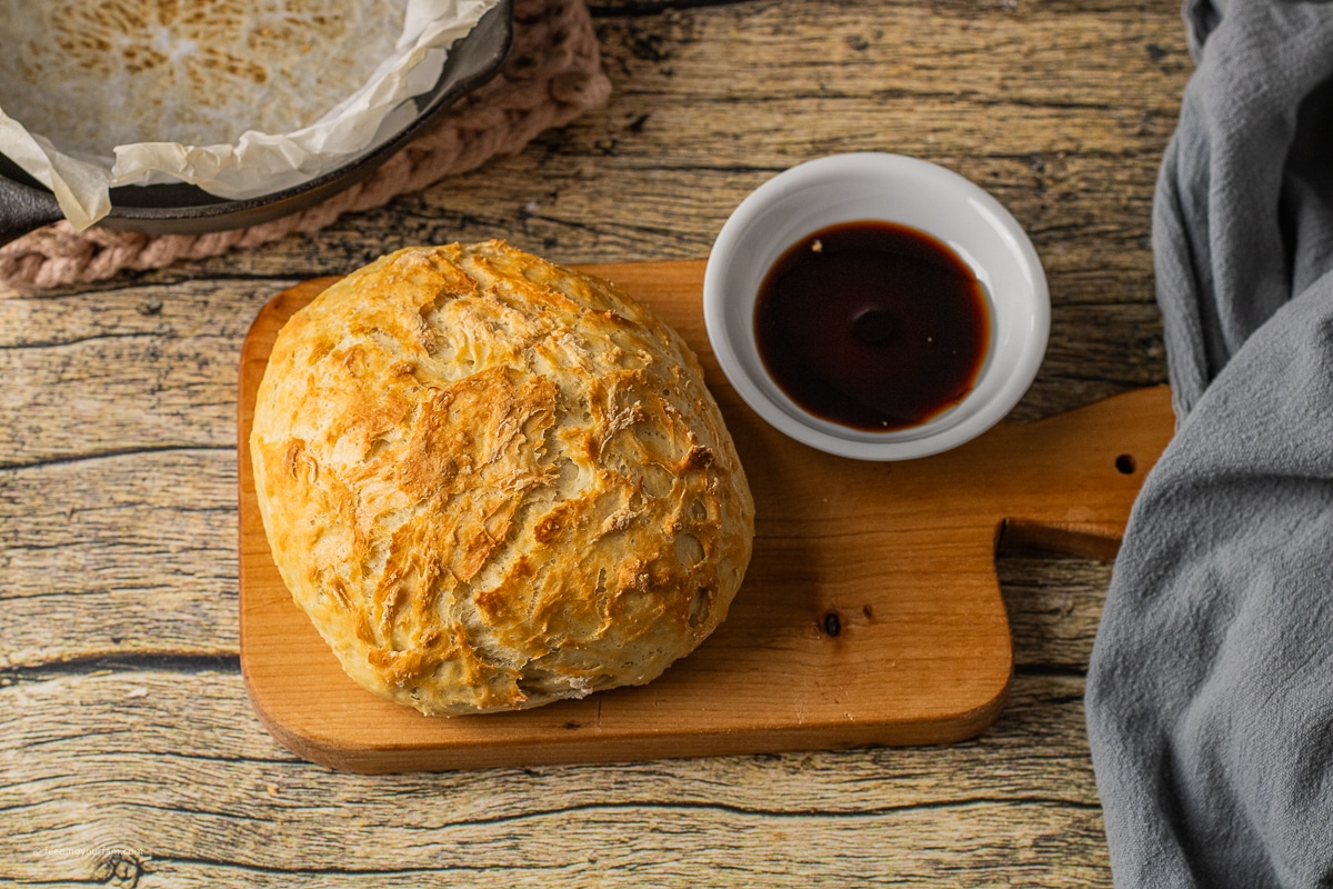 small loaf of bread on a wooden cutting board