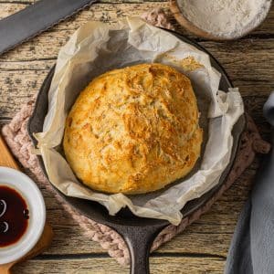 small loaf of skillet bread baked in a cast iron skillet