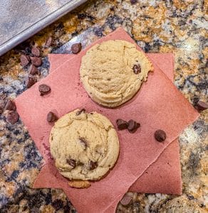 soft chocolate chip cookies on a piece of parchment paper