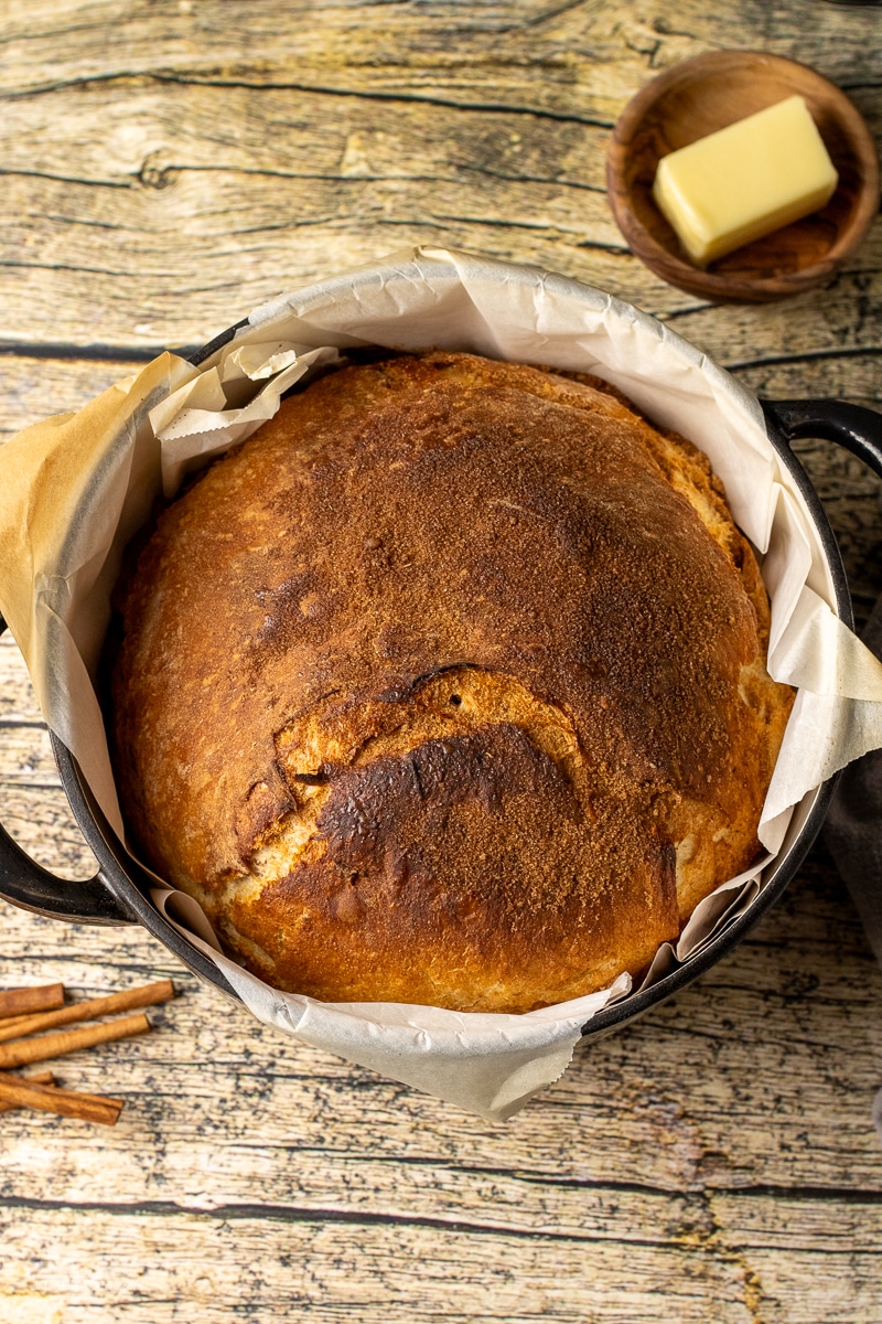 The sweet flavors of Cinnamon and Sugar come together perfectly in this easy Dutch Oven Cinnamon Swirl Bread recipe. Each bite is a touch of sweet cinnamon flavor and the crunchy crust and soft, pillowy center is hard to resist.
