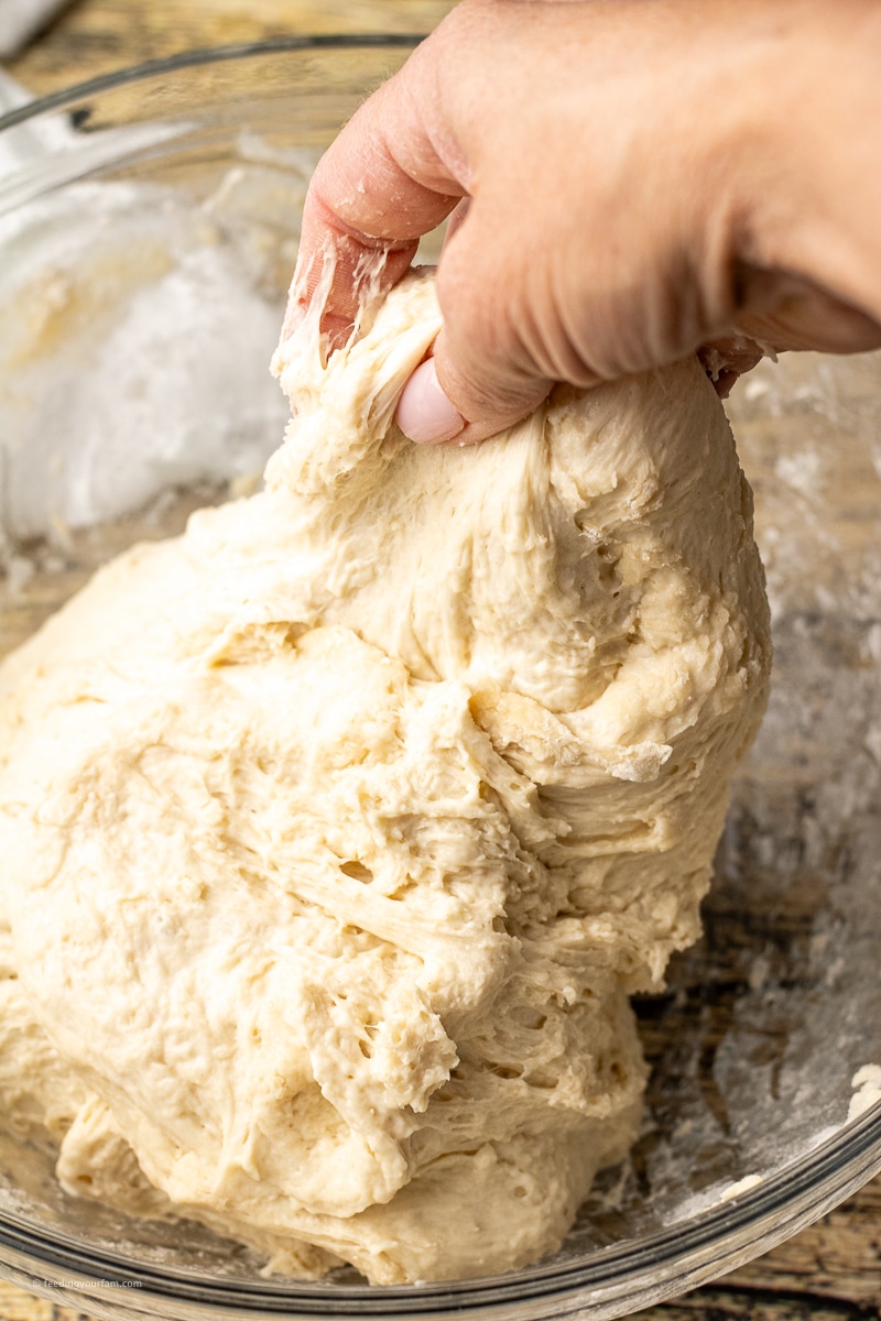 stretching dough over into a ball