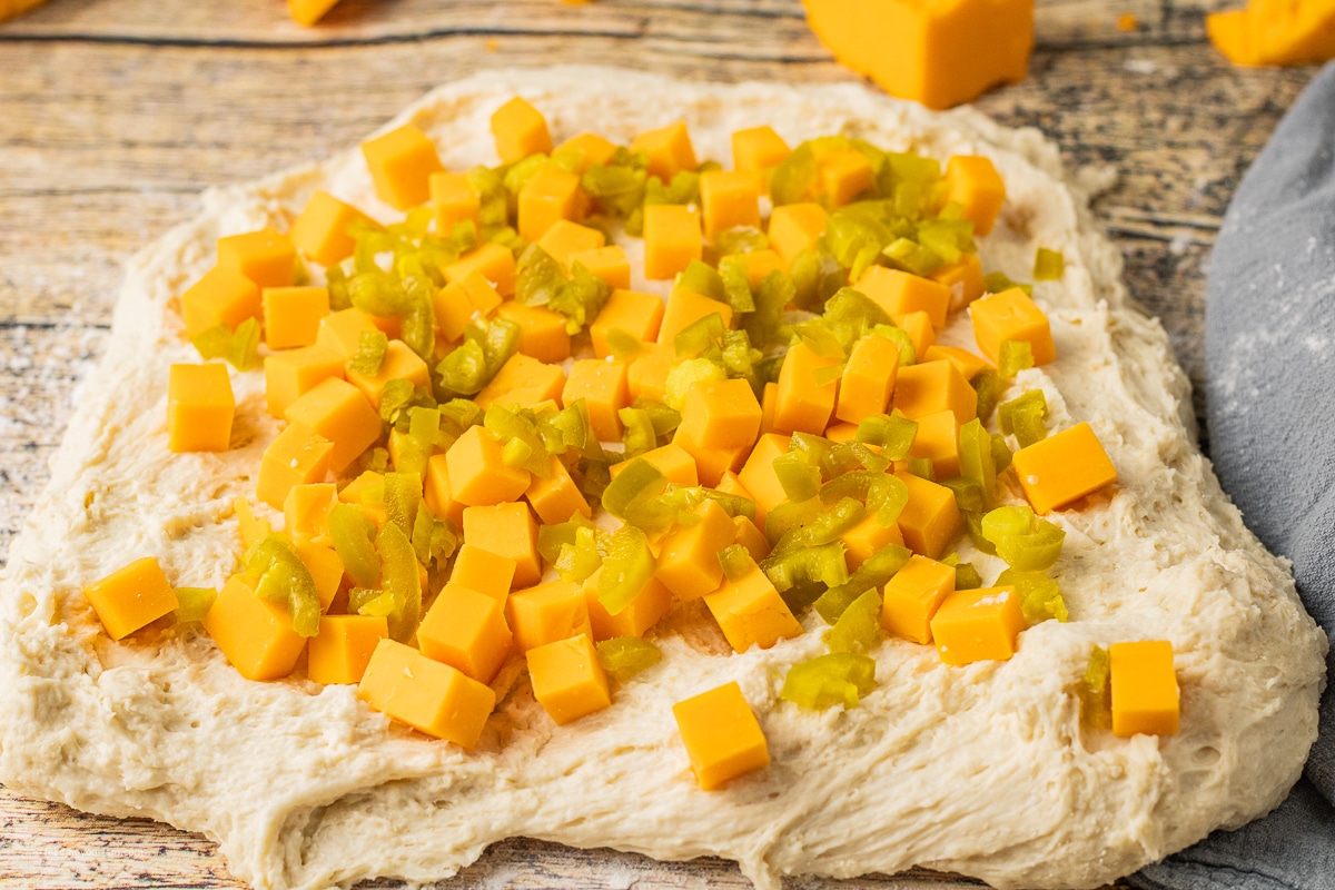 jalapeno cheddar bread with chunks of cheddar cheese and diced jalapenos