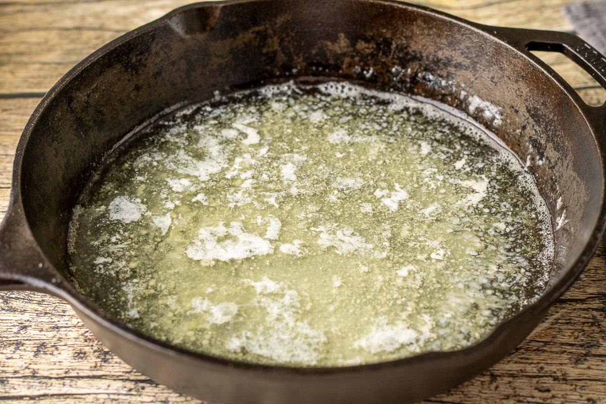 melted butter in a cast iron skillet to make butter swim biscuits