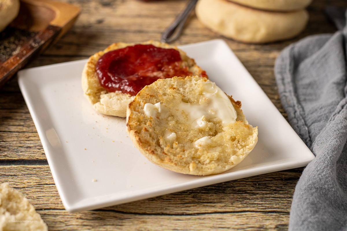 melted butter and jam on open faced homemade English muffin halves