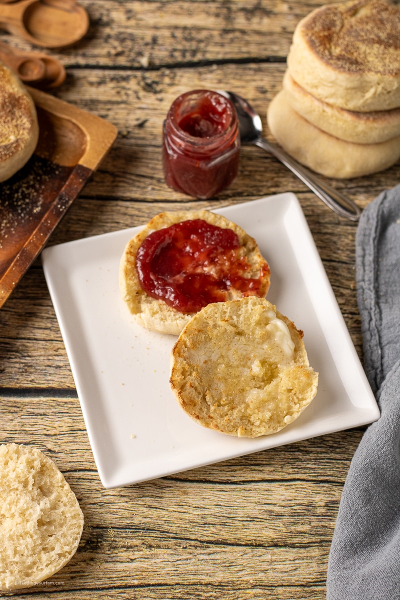 Homemade English muffins are cooked in a cast iron skillet on the stovetop for a soft, chewy texture with classic nooks and crannies. Breakfast recipe.