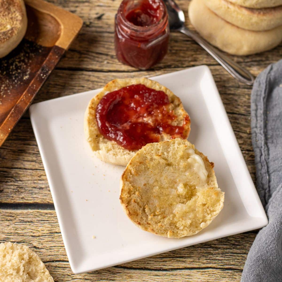 homemade English muffins are cooked in a cast iron skillet on the stovetop for a soft, chewy texture with classic nooks and crannies.